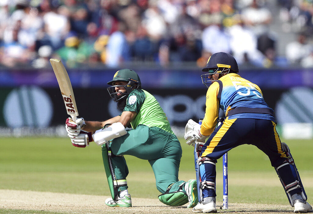 South Africa's batsman Hashim Amla, left, watches his shot.
