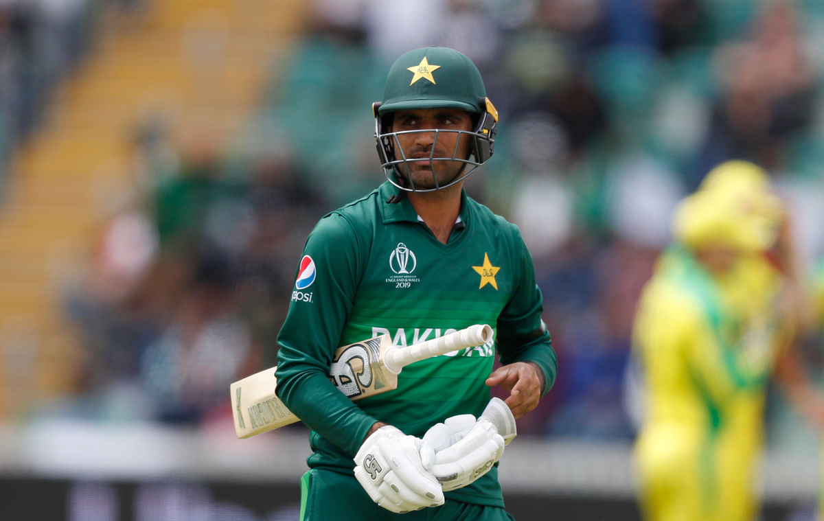 Fakhar Zaman walks from the pitch after being given out.