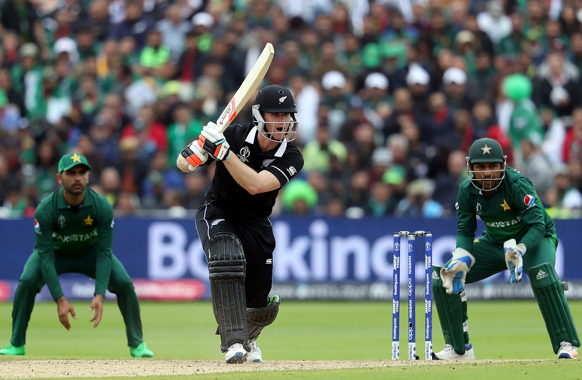 Neesham Plays a shot.