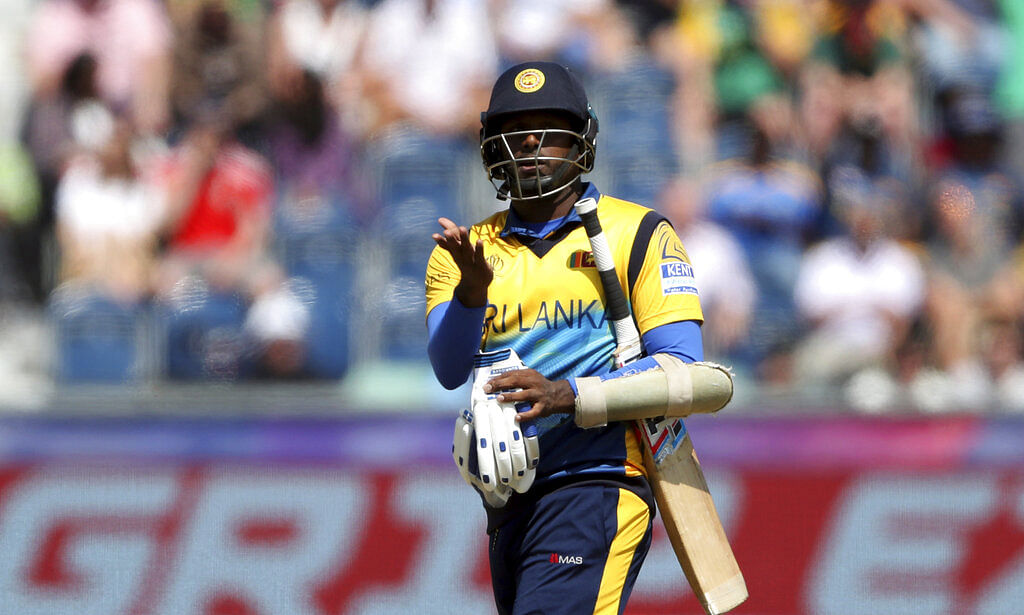 Angelo Mathews reacts as he leaves the crease after being bowled by South Africa's bowler Chris Morris for 30 runs.