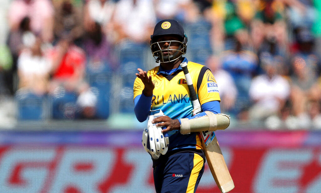Angelo Mathews reacts as he leaves the crease after being bowled by South Africa's bowler Chris Morris for 30 runs.