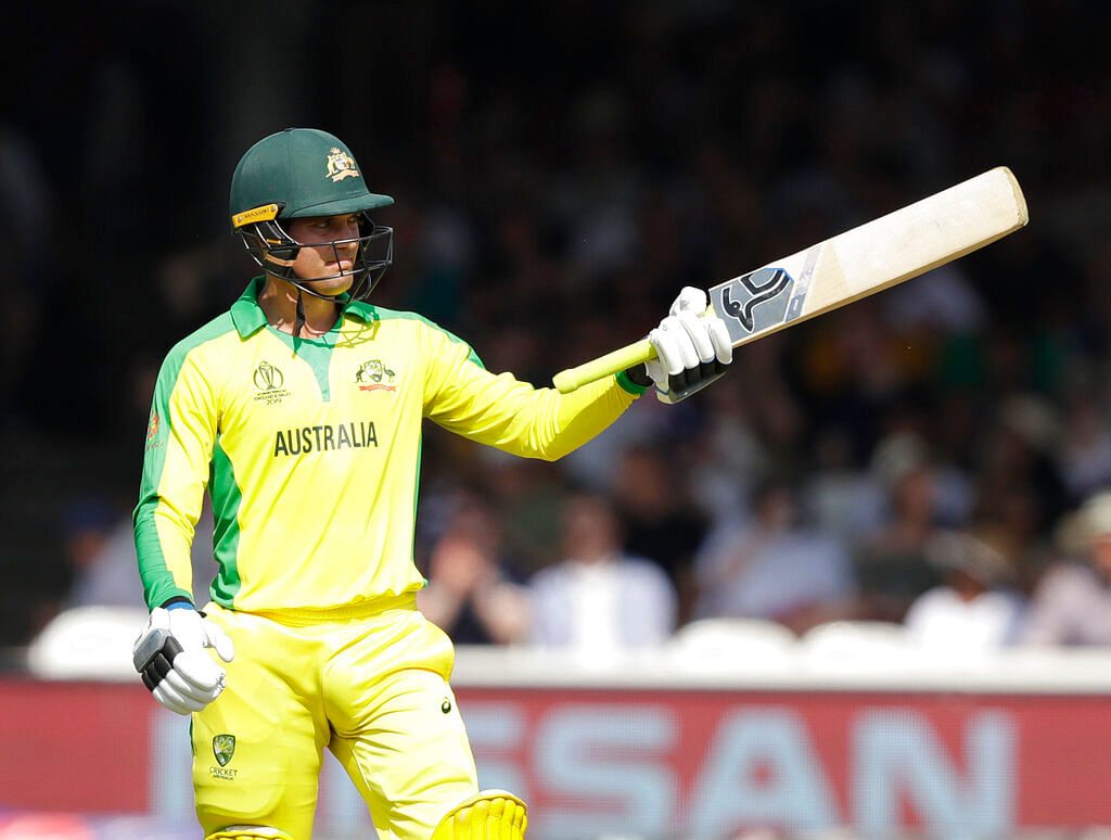 Australia's Alex Carey celebrates getting 50 runs not out during the Cricket World Cup match between New Zealand and Australia.