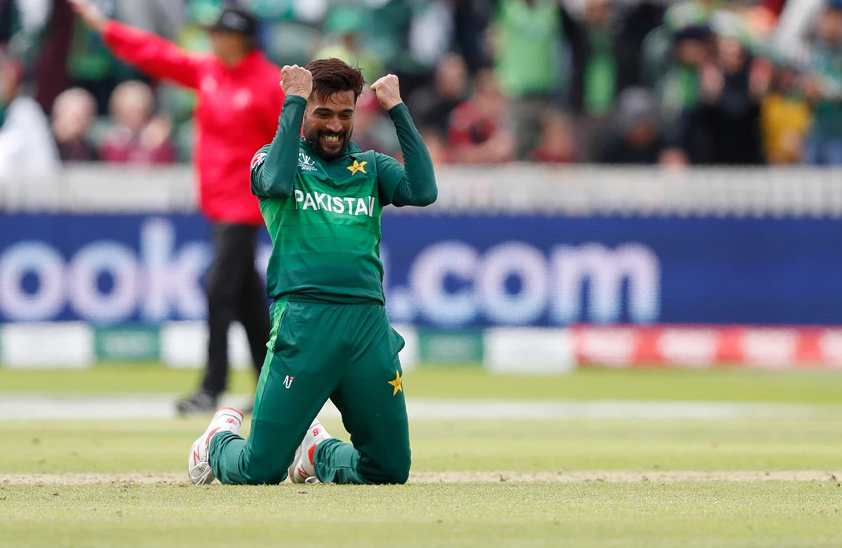 Mohammad Amir celebrates after taking the wicket of Australia's Mitchell Starc.