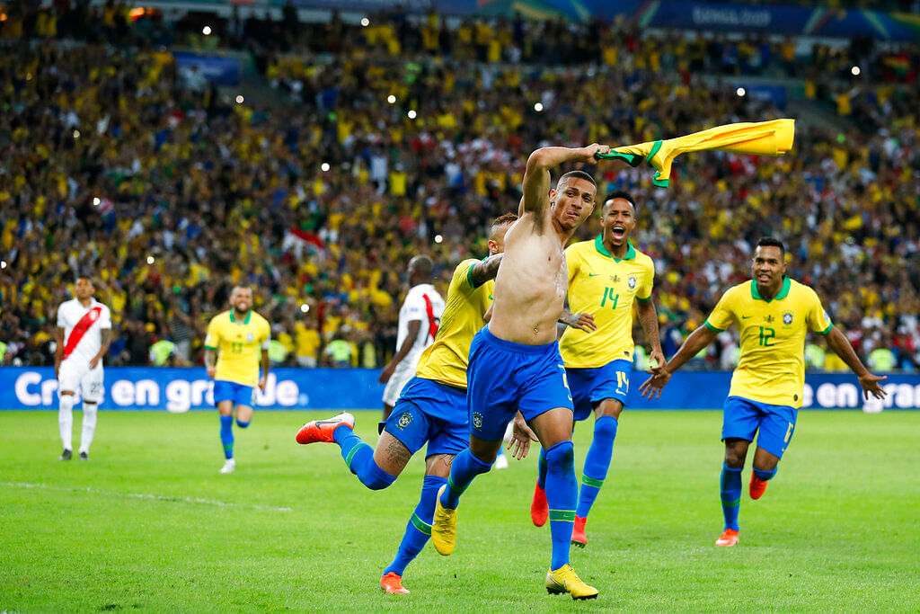 Brazil's Richarlison celebrates with teammates after scoring his side's third goal against Peru during the final soccer match of the Copa America at the Maracana stadium in Rio de Janeiro.