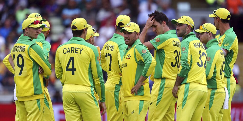 Australia's captain Aaron Finch, middle, with teammates