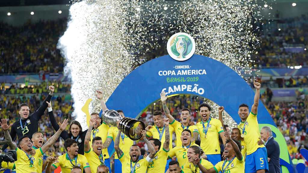 Brazil's team pose with trophy.