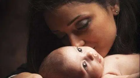 newborn baby with mother