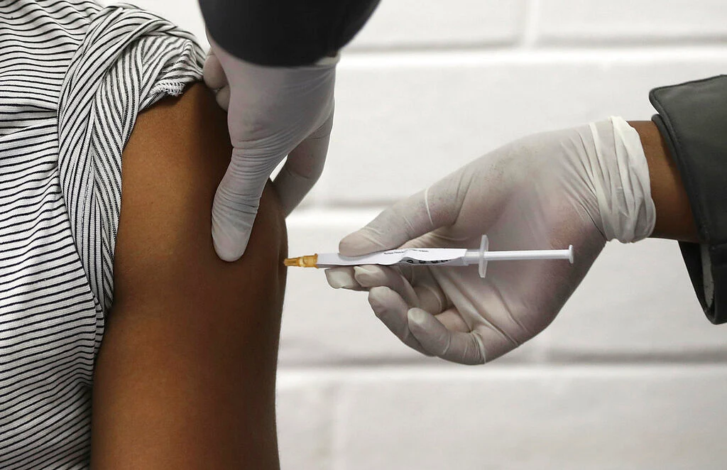 A vaccine volunteer receives an injection Johannesburg