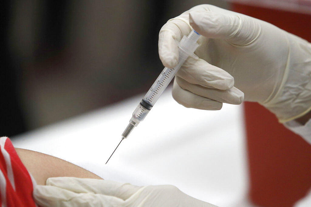 File photo shows a patient receiving a flu vaccination in Mesquite, Texas.