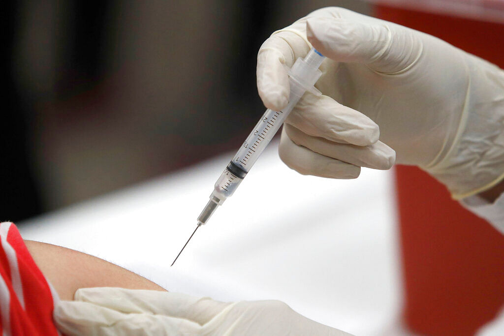 File photo shows a patient receiving a flu vaccination in Mesquite, Texas.