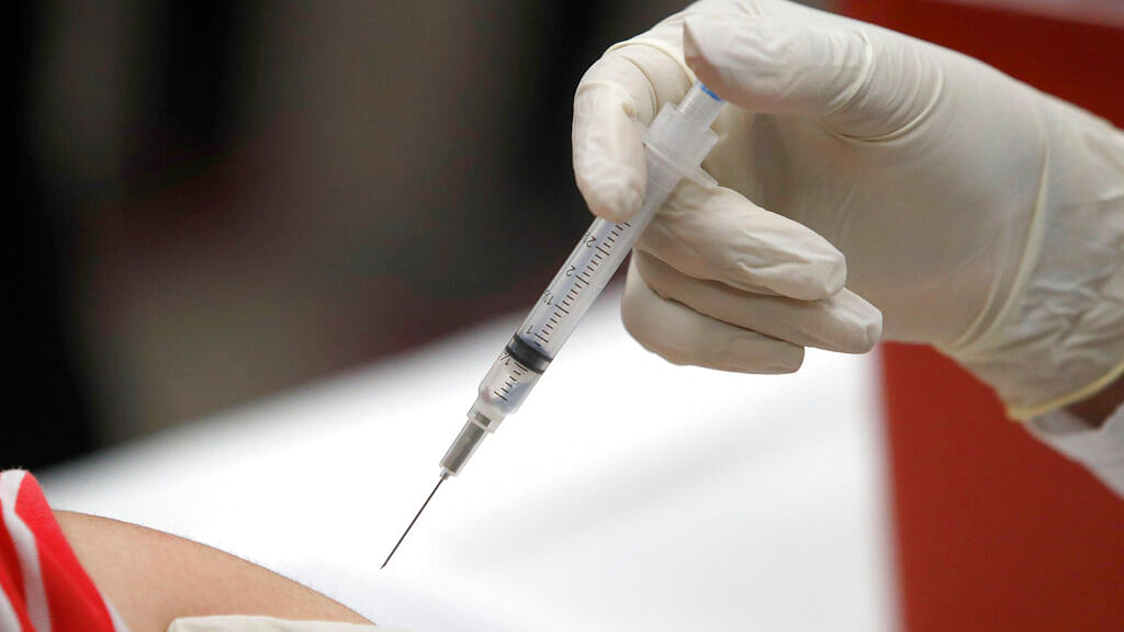 File photo shows a patient receiving a flu vaccination