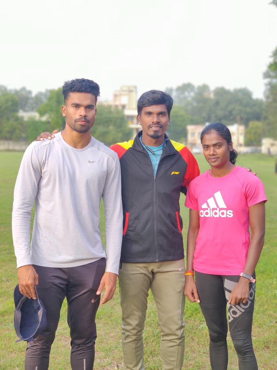 Dhanalakshmi with coach Manikandan