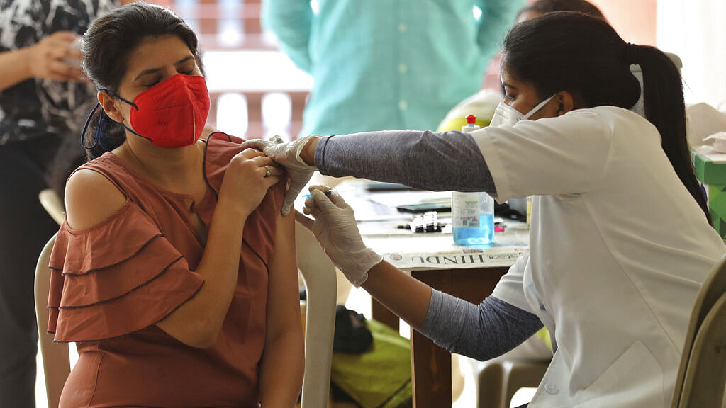 A woman receives the vaccine