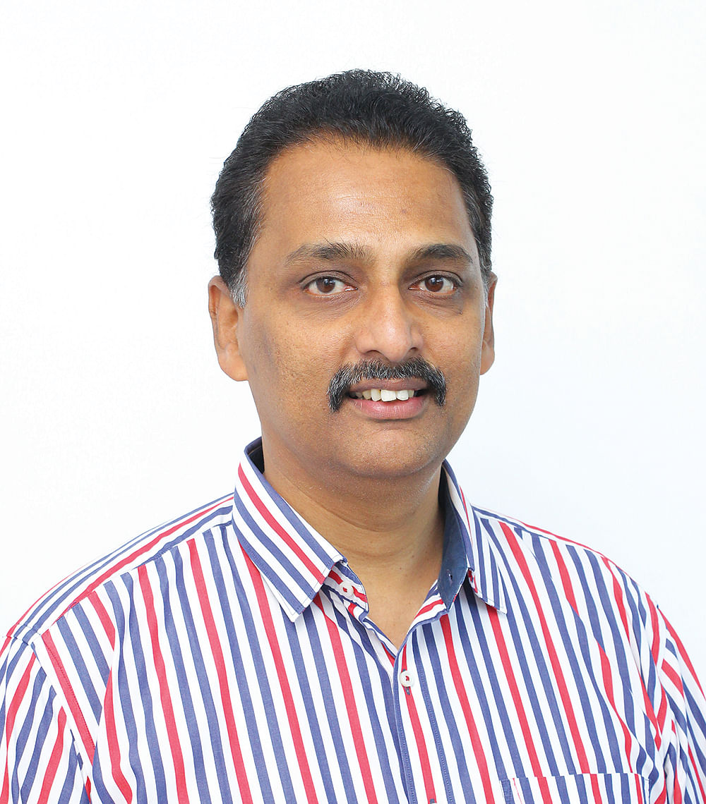 ரெஜி தாமஸ், பங்குச் சந்தை நிபுணர்