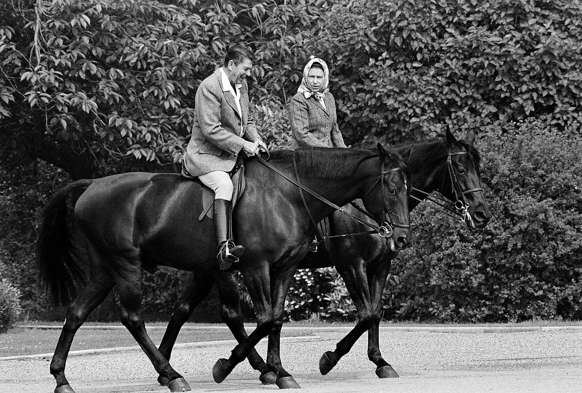 U.S. President Ronald Reagan riding Centennial, and Britain's Queen Elizabeth II