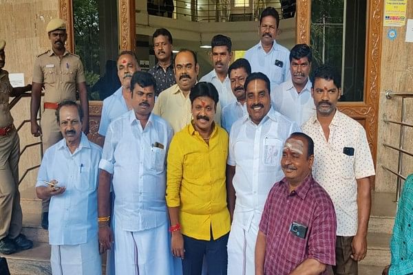 Isaki Subbiah with party members at the collector's office