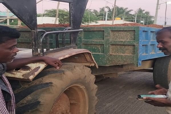 Tractor standing with sand