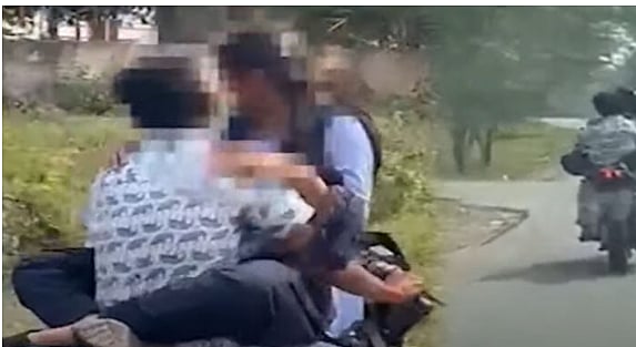 இதெல்லாம்  டூமச்... டூவீலர்  பெட்ரோல் டேங்க் மீது மாணவி; கட்டிப்பிடித்தபடி வண்டி ஓட்டிய காதலன்!