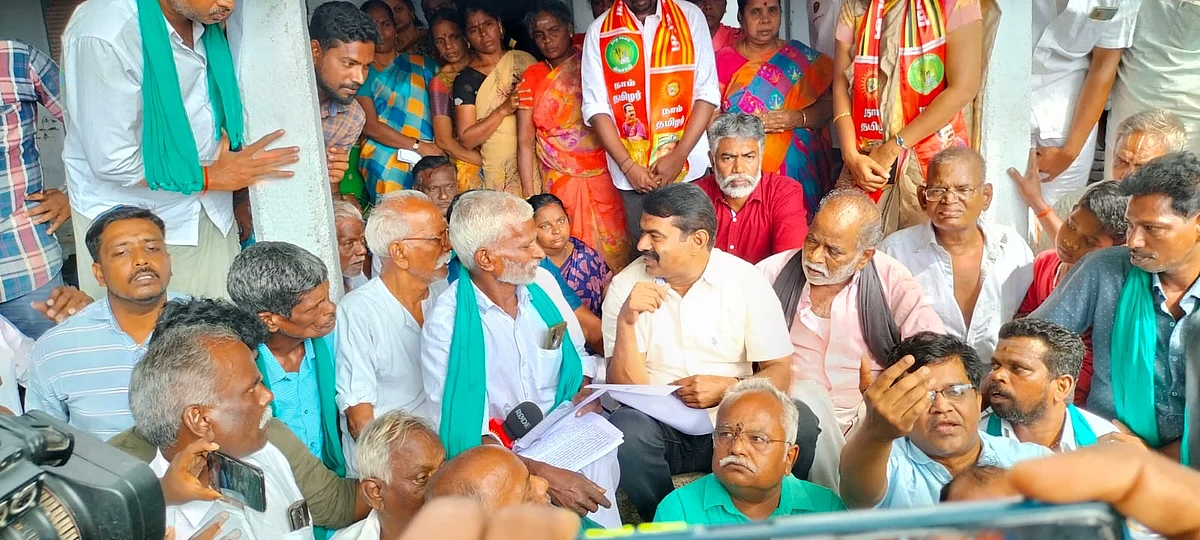 சாலை அமைப்பதற்கு எதிராகப் போராடும் விவசாயிகள்