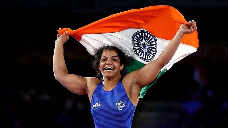 Sakshi Malik: `சாத்தான்கள் வேதம் ஓத கலங்கி நிற்கும் தேவதை!' - சாக்‌ஷி மாலிக்கின் கதை!