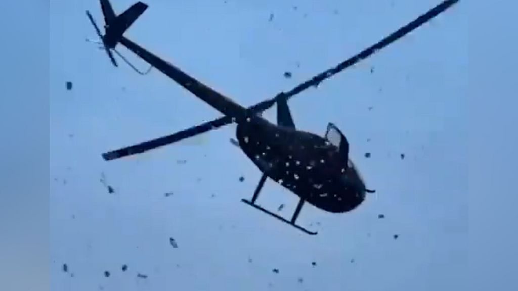 US dollars thrown from helicopter during funeral