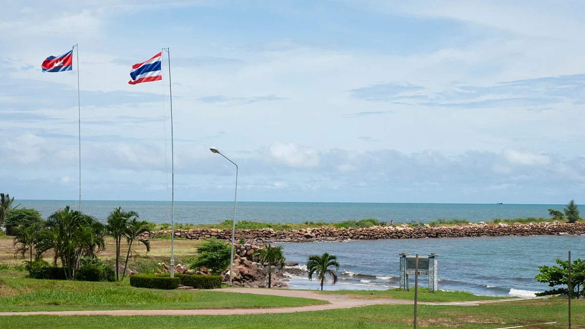 Thai and Cambodian flags at Cham Yeam border crossing 